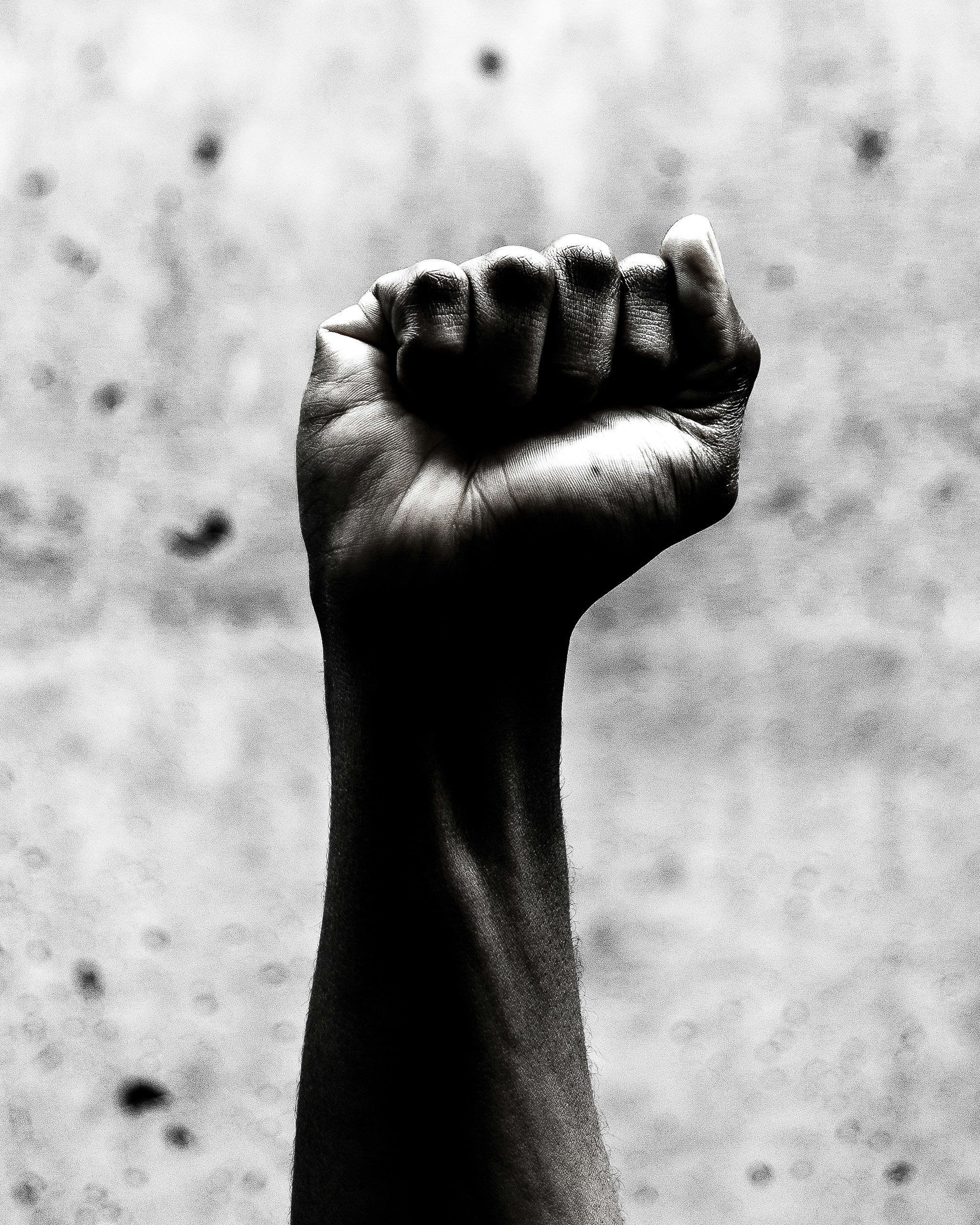 person's right fist grayscale photography