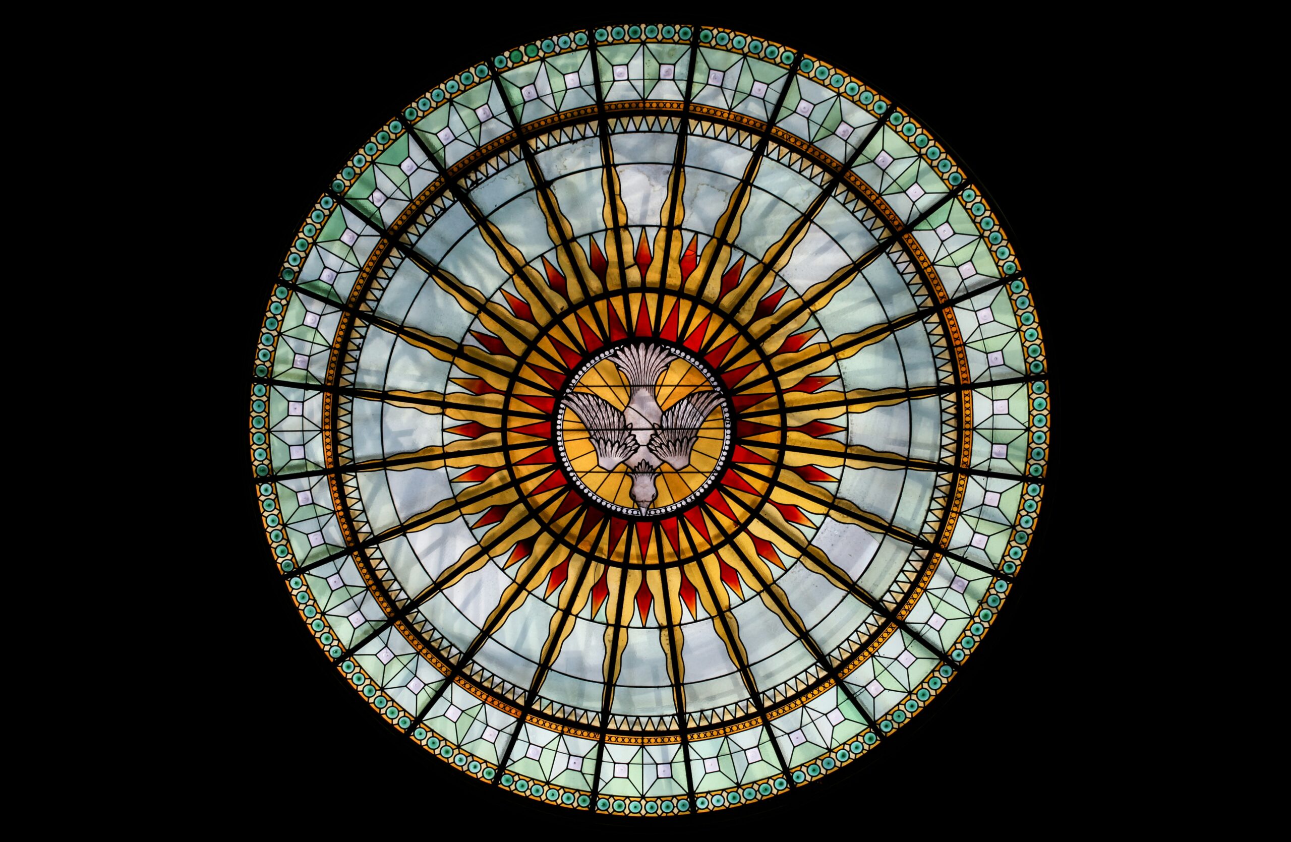 round white, beige, and red stained glass roofing