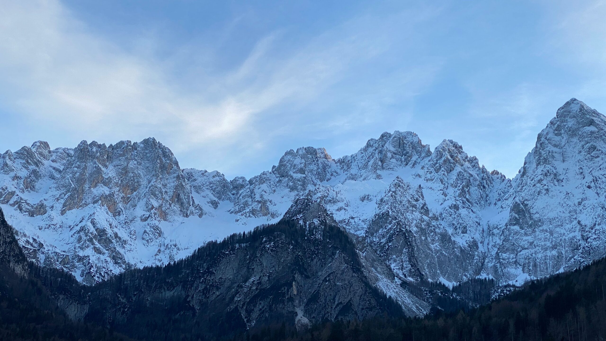 snow covered mountain under blue sky during daytime