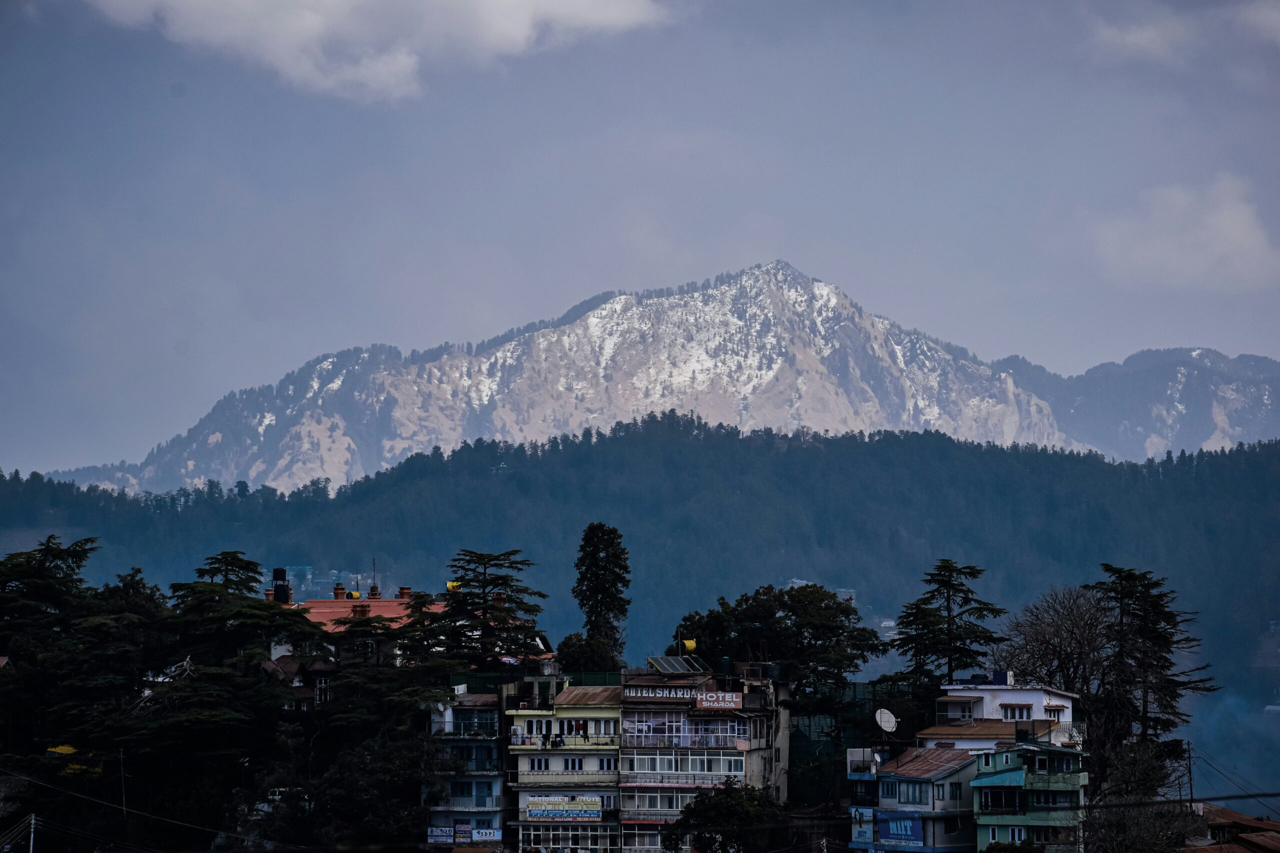 a view of a snow covered mountain in the distance