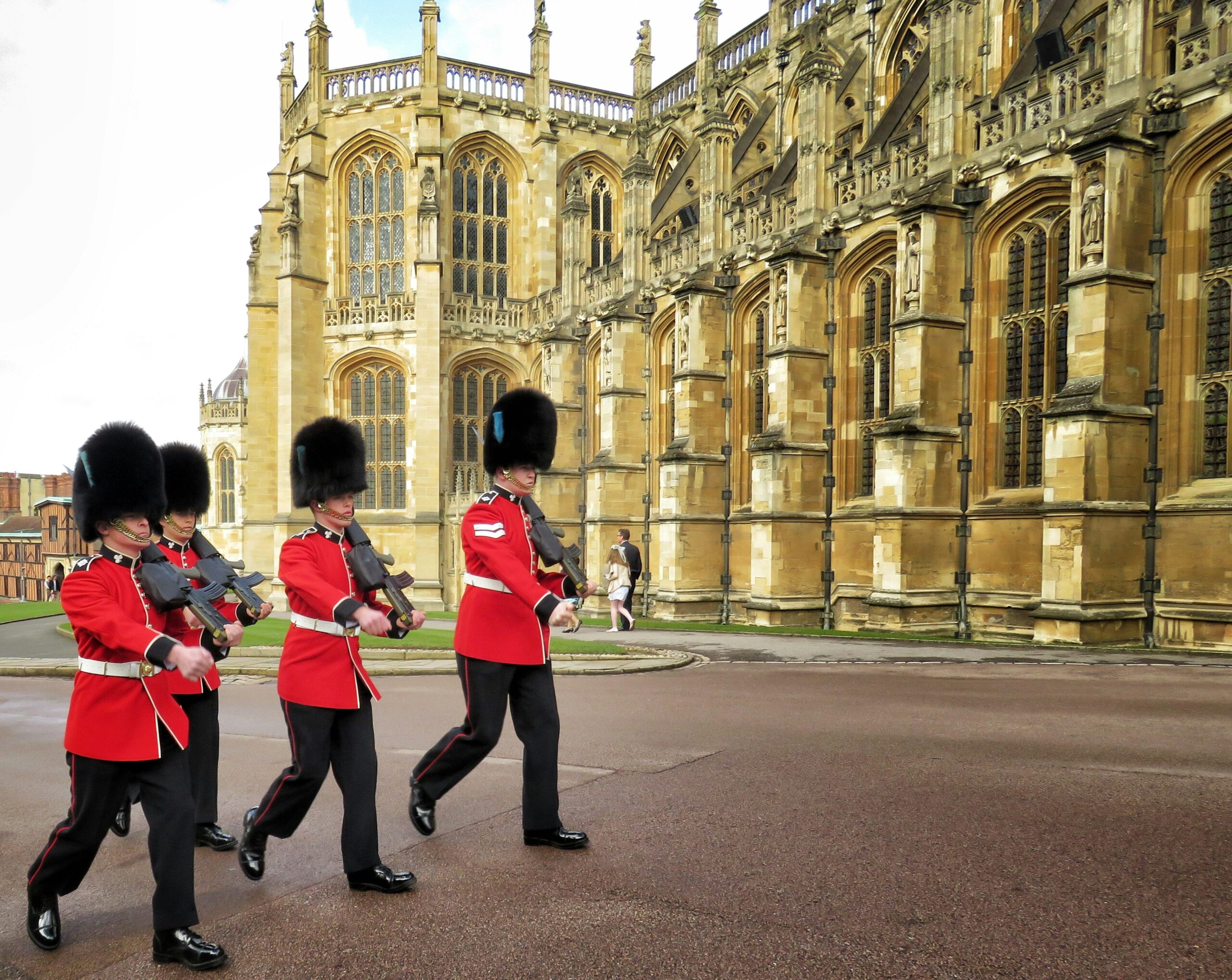 four Royal Guards marching outside palace