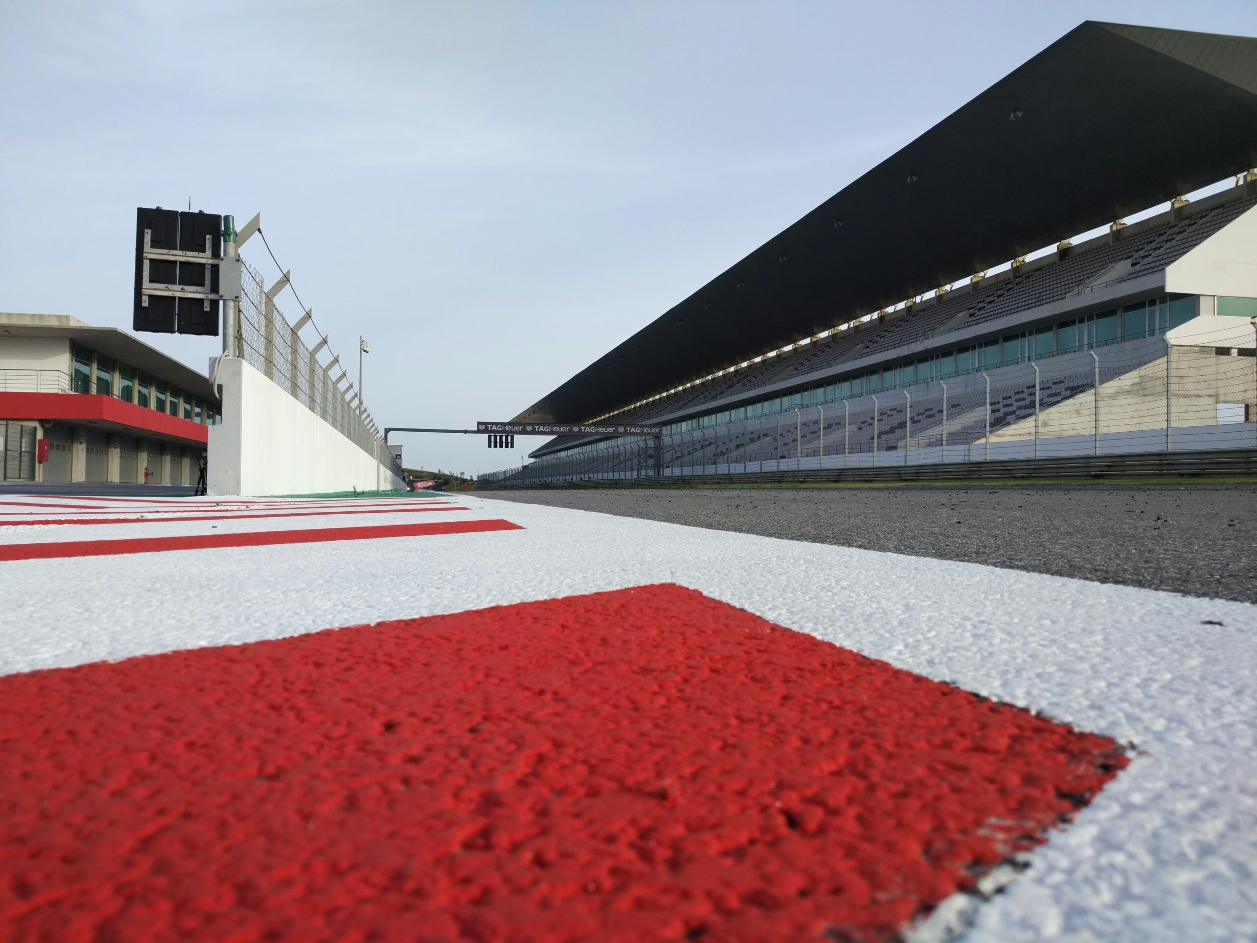 red and white race way near concrete building