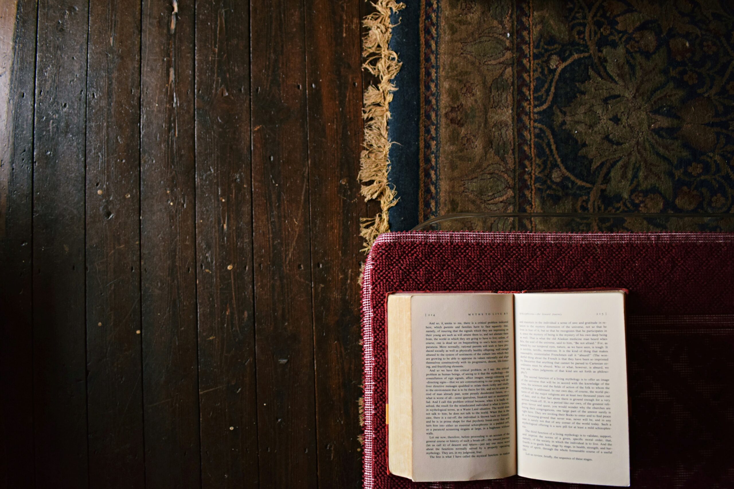 white book on maroon mat