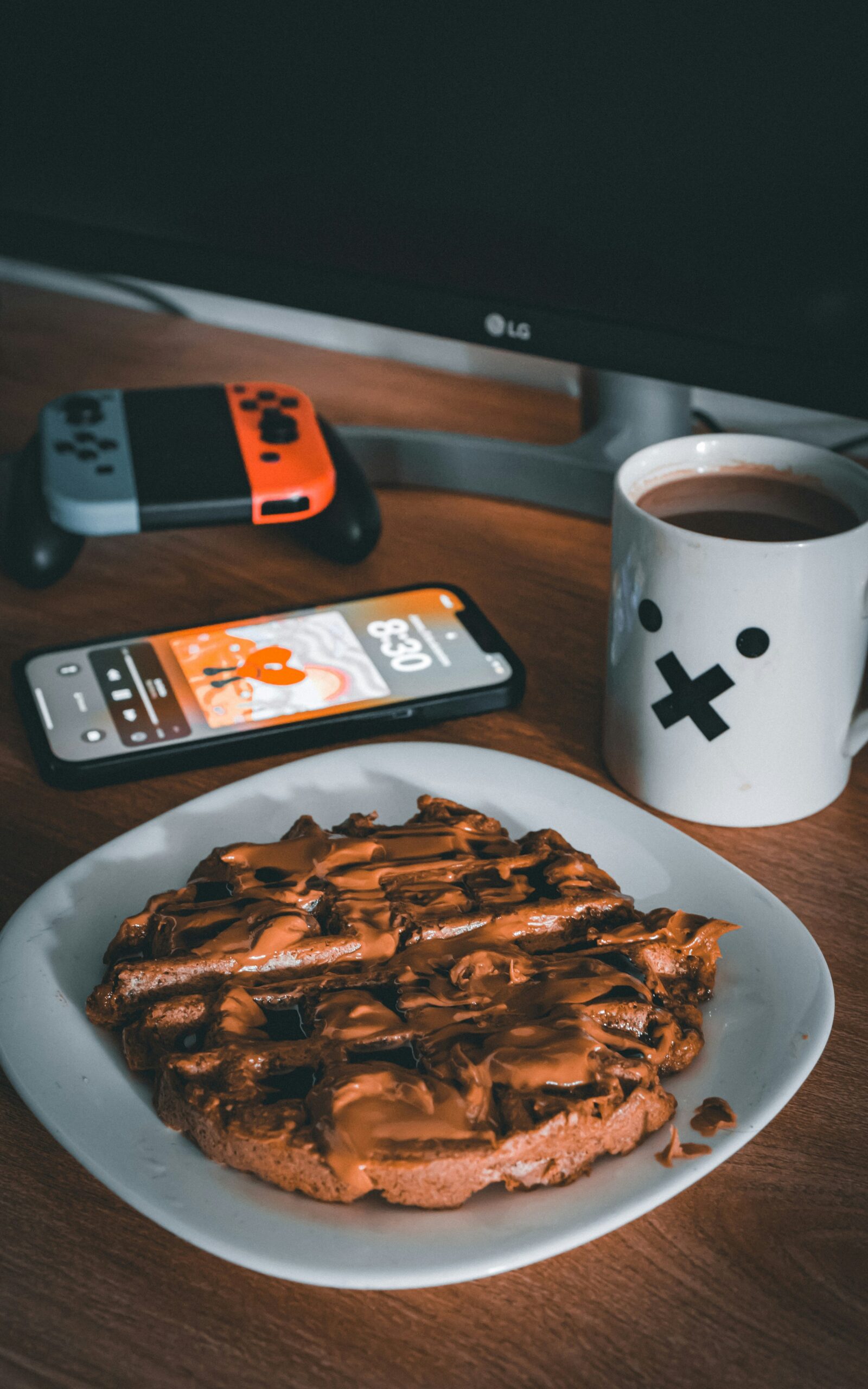 a plate of waffles and a cup of coffee