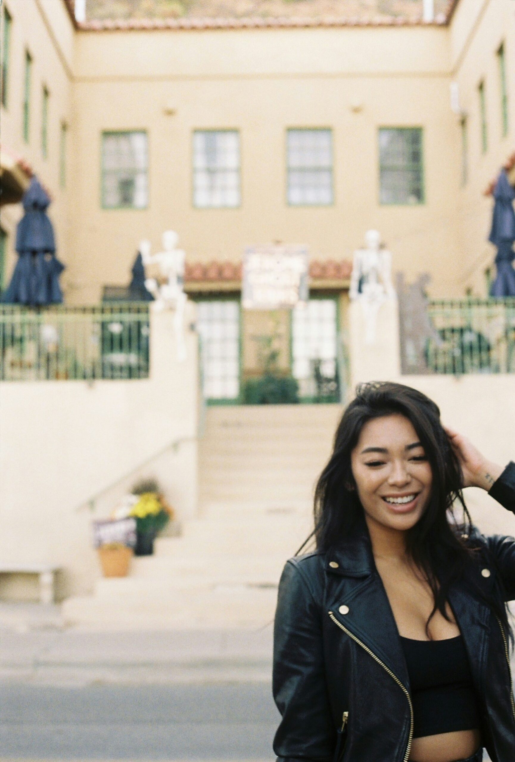 A woman standing in front of a building