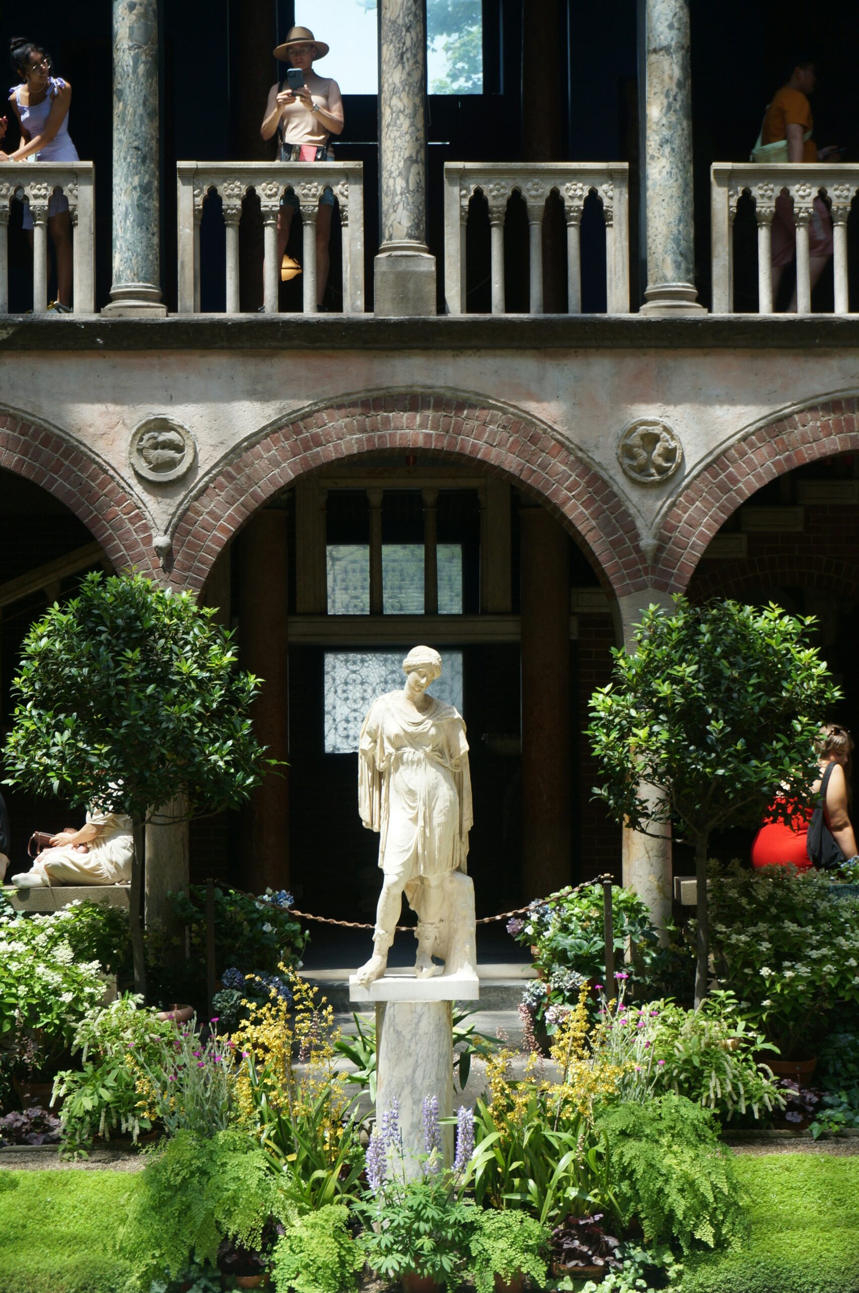 A statue of a man standing in front of a building