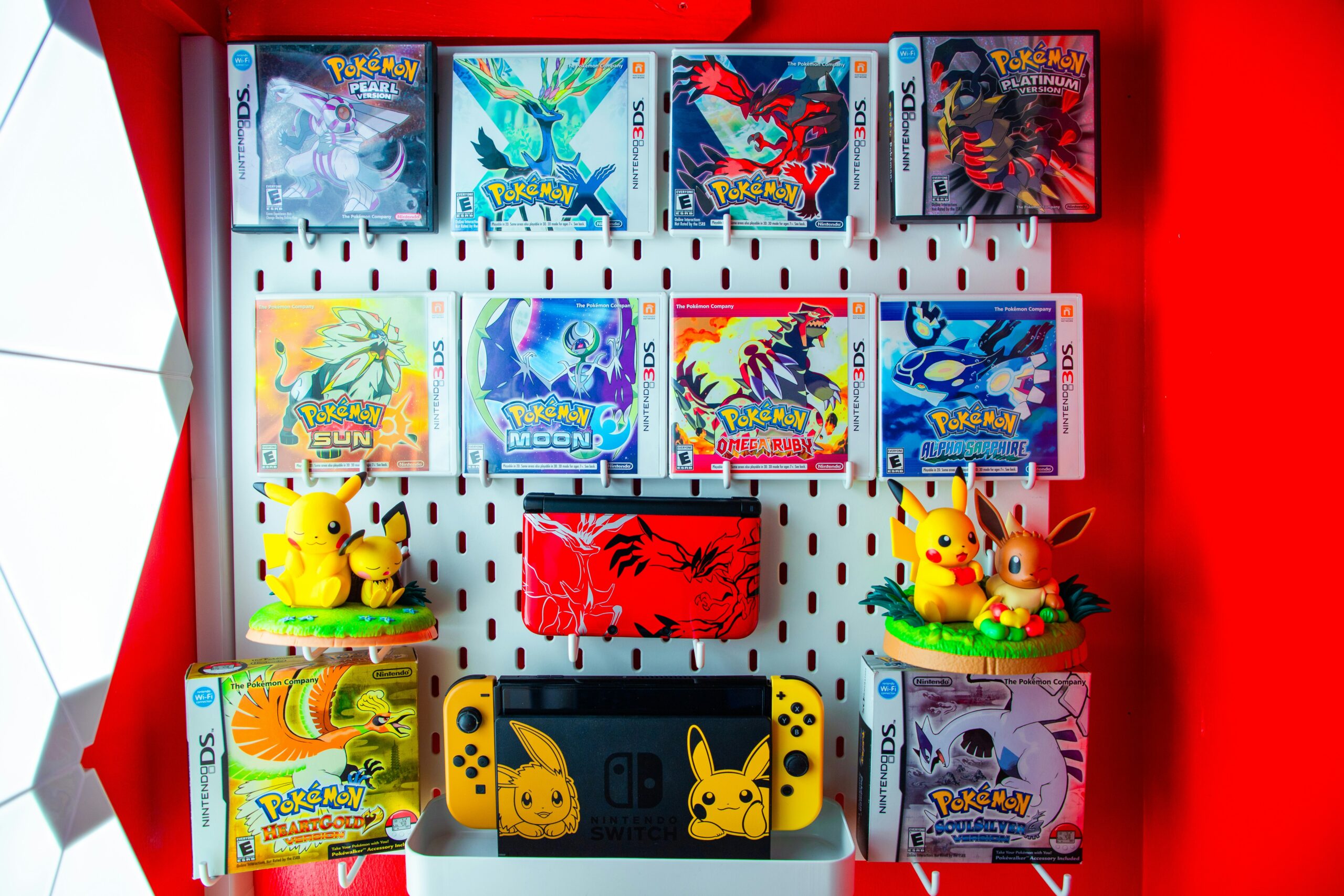 a display of pokemon trading cards and figurines